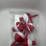 Five red and white bobber golf tees inside a clear bag